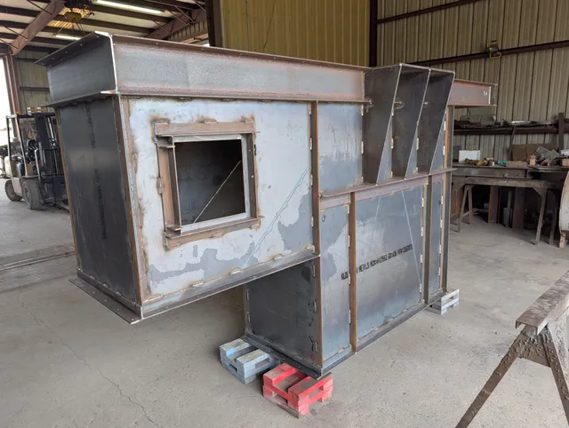 Grain elevator boot section with access opening fabricated in the shop